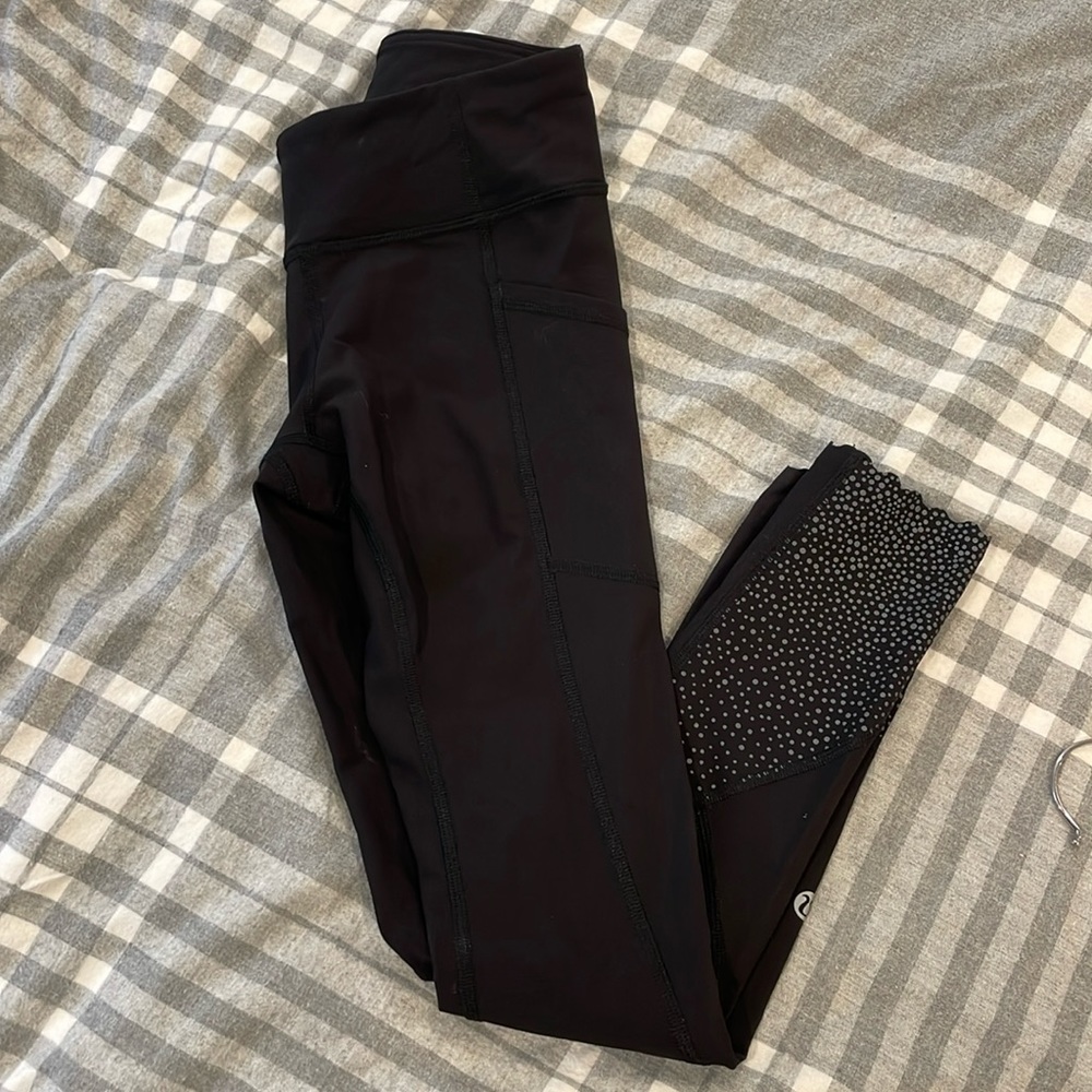 Women’s black lululemon cropped leggings size 2. Scalloped bottoms.